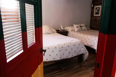 Cama o camas de una habitación en Hotel La Estacion