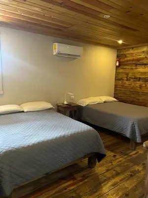 Cama o camas de una habitación en Hotel La Estacion