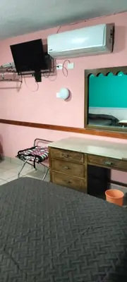 Una televisión o centro de entretenimiento en Hoteles Santa Regina