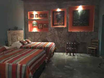 Cama o camas de una habitación en Hostal Doña Carlota Hotel