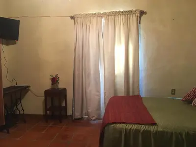 Cama o camas de una habitación en Hostal Doña Carlota Hotel