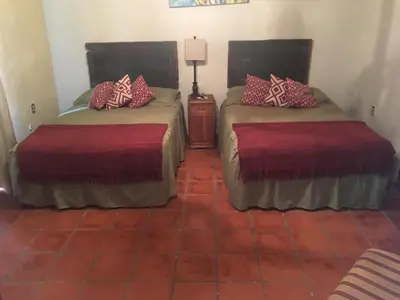 Cama o camas de una habitación en Hostal Doña Carlota Hotel