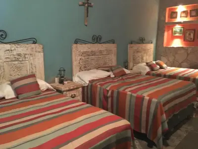 Cama o camas de una habitación en Hostal Doña Carlota Hotel
