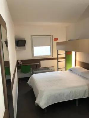 Cama o camas de una habitación en Hotel Hi ! Torreon Aeropuerto-Galerías