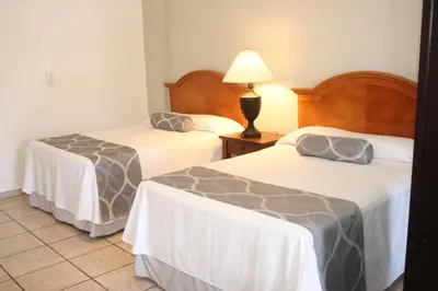 Cama o camas de una habitación en Hotel Posada Doña Rubino