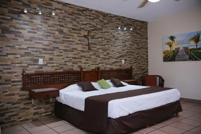 Cama o camas de una habitación en Hotel Posada Santa Fe Sabinas