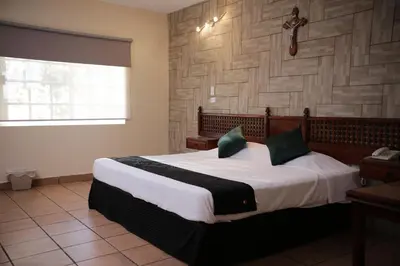 Cama o camas de una habitación en Hotel Posada Santa Fe Sabinas