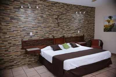 Cama o camas de una habitación en Hotel Posada Santa Fe Sabinas