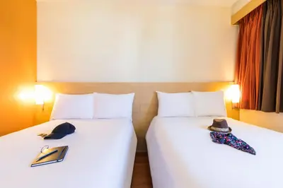 Cama o camas de una habitación en Ibis Juarez Consulado