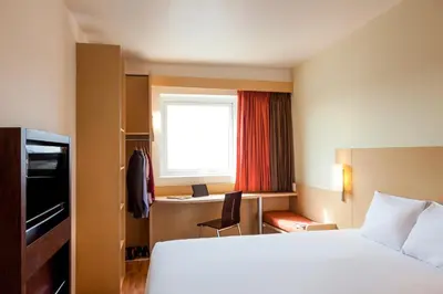 Cama o camas de una habitación en Ibis Juarez Consulado