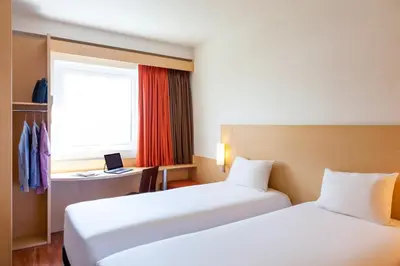 Cama o camas de una habitación en Ibis Hermosillo