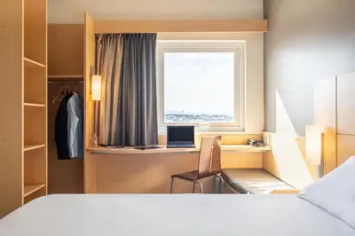 Cama o camas de una habitación en Ibis Chihuahua