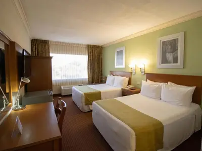Cama o camas de una habitación en Hotel Araiza Hermosillo