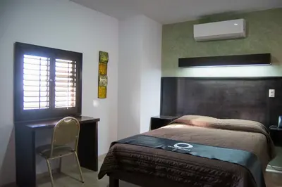 Cama o camas de una habitación en Hotel Onix Suites