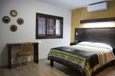 Cama o camas de una habitación en Hotel Onix Suites