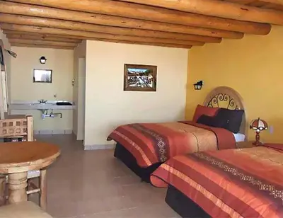 Cama o camas de una habitación en Hotel Mansion Tarahumara