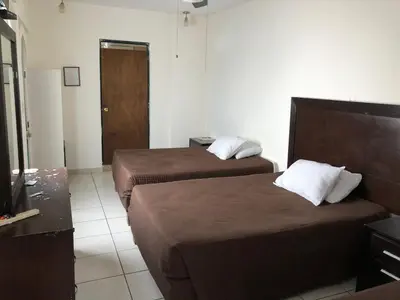 Cama o camas de una habitación en Hotel María Elena