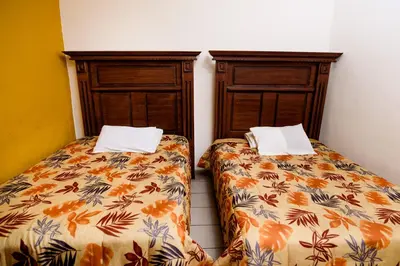Cama o camas de una habitación en Hotel María Elena