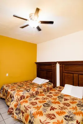 Cama o camas de una habitación en Hotel María Elena