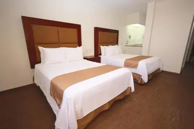 Cama o camas de una habitación en Gamma Durango Plaza Vizcaya