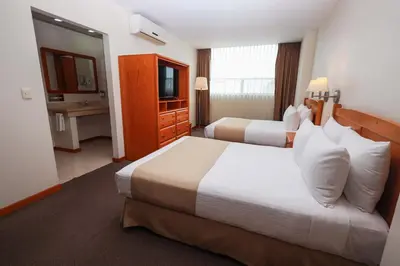 Cama o camas de una habitación en Gamma Durango Plaza Vizcaya