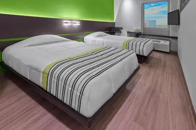 Cama o camas de una habitación en City Express Junior by Marriott Juarez Consulado
