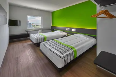 Cama o camas de una habitación en City Express Junior by Marriott Juarez Consulado