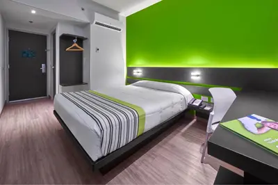 Cama o camas de una habitación en City Express Junior by Marriott Juarez Consulado