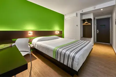 Cama o camas de una habitación en City Express Junior by Marriott Juarez Consulado