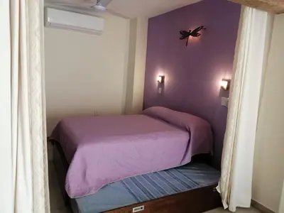 Cama o camas de una habitación en Aguacate Suites
