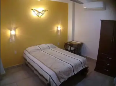 Cama o camas de una habitación en Aguacate Suites