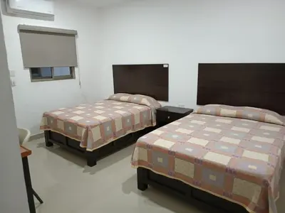 Cama o camas de una habitación en Hotel Romo