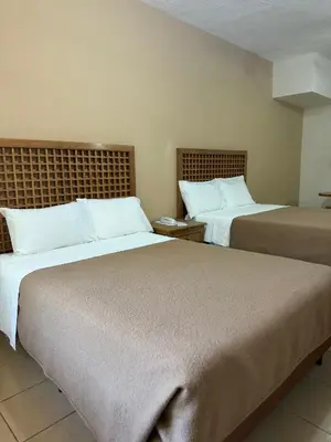 Cama o camas de una habitación en Hotel El Dorado