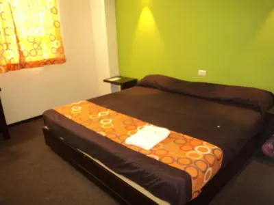 Cama o camas de una habitación en Hotel Santa Cruz Mochis
