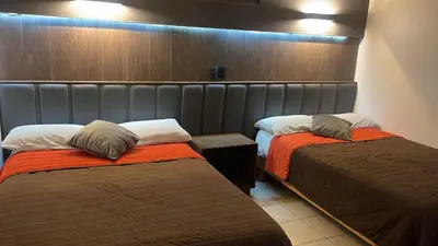 Cama o camas de una habitación en Hotel Santa Cruz