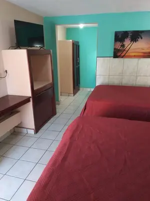 Cama o camas de una habitación en Hotel Duve Coral
