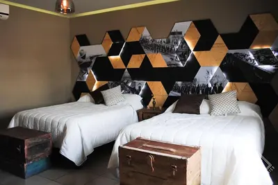 Cama o camas de una habitación en Doroteo Hotel Boutique