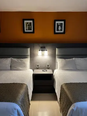 Cama o camas de una habitación en Hotel El Rancho