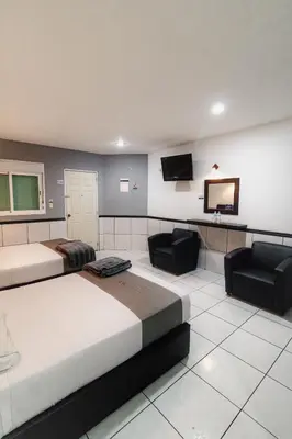 Cama o camas de una habitación en Hotel Maioris El Diez Culiacan