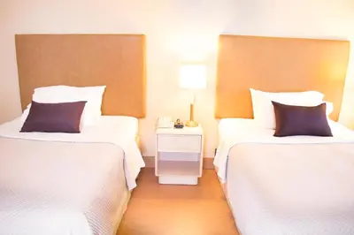 Cama o camas de una habitación en iStay Hotel Ciudad Juarez