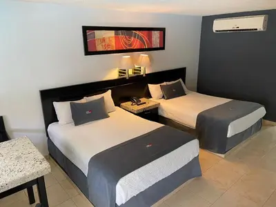 Cama o camas de una habitación en Hotel La Finca