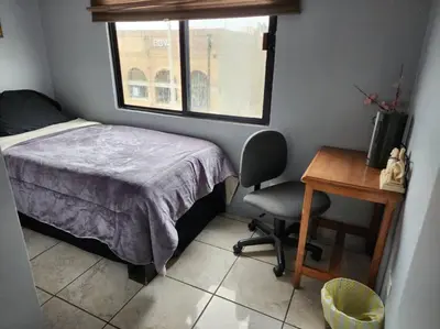 Cama o camas de una habitación en Apartment Downtown Cananea