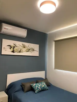 Cama o camas de una habitación en Condominio con alberca en Zona Cerritos