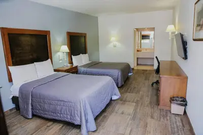Cama o camas de una habitación en Hotel Villa del Sol