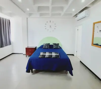 Cama o camas de una habitación en Hotel Allende 104