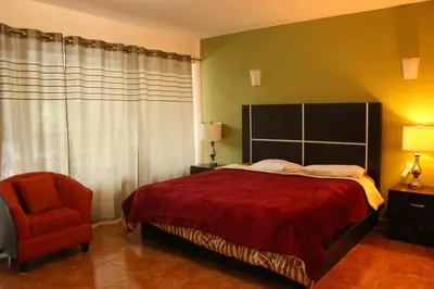 Cama o camas de una habitación en Vista Potrero - Hotel, Camping & Events