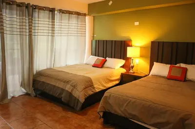 Cama o camas de una habitación en Vista Potrero - Hotel, Camping & Events