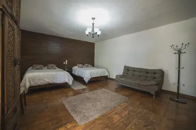 Cama o camas de una habitación en Hotel Posada las Nubes