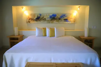 Cama o camas de una habitación en Tripui Hotel