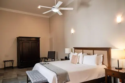 Cama o camas de una habitación en Casa Lucila Mazatlán Curamoria Collection